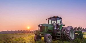 Farm Tractor in a field on a Maryland Farm at sunset